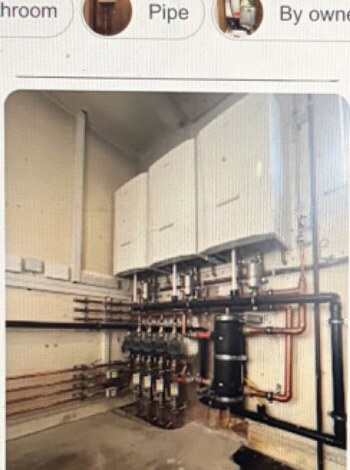 Neatly installed heating pipework and controls